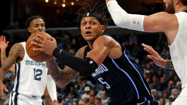 Orlando Magic’s Paolo Banchero holding the basketball